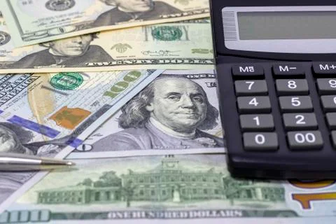 Calculator and dollars. Stock Photos
