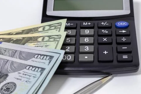 Calculator and dollars. Stock Photos