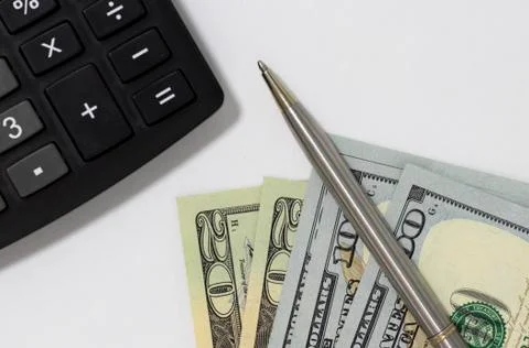 Calculator and dollars. Stock Photos