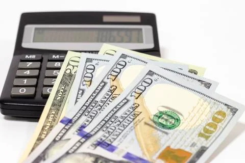 Calculator and dollars. Stock Photos