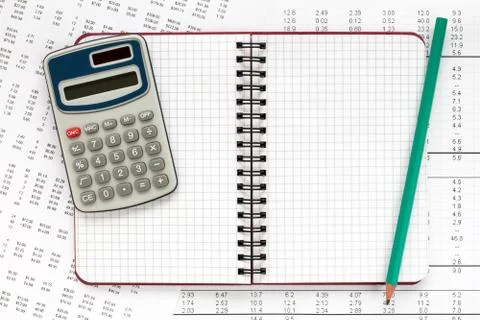 Calculator and notebook on financial statement. Stock Photos
