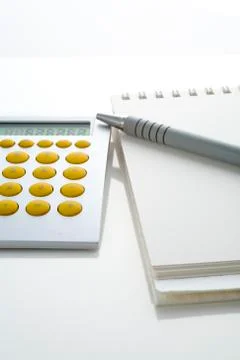 Calculator and notebook Stock Photos
