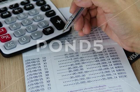 Calculator and pen on bank account passbook, selective focus Stock Photos