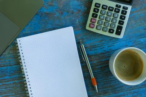Calculator and pen on the table Stock Photos