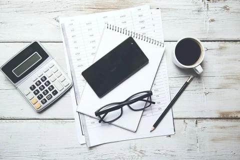 Calculator and phone on  document Stock Photos