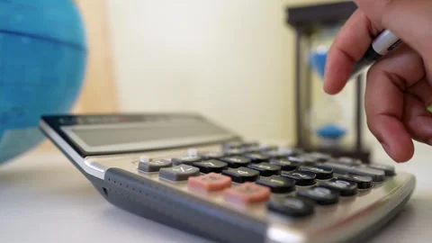 Calculator and Time Management Tools in Office Setting Stockbeeldmateriaal 318056794