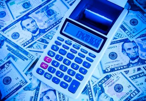 Calculator on the banknotes dollars Stock Photos