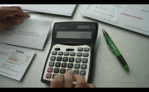 Calculator being used Stock Footage 295465777