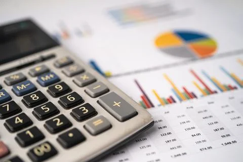 Calculator on chart and graph paper. Finance, Account, Statistics, Analytic.. Stockfoto's