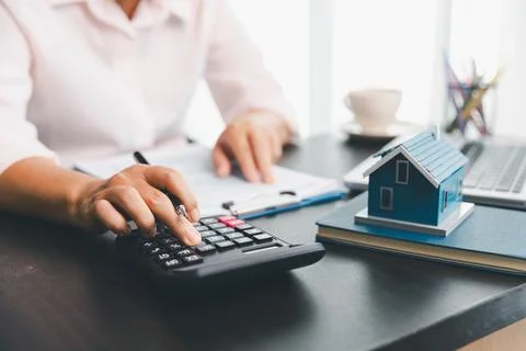 Calculator to check and summary expense of home loan mortgage for refinance.. Stock Photos