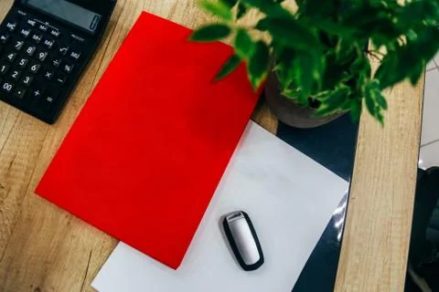 Calculator, document folder and car keys Stock Photos