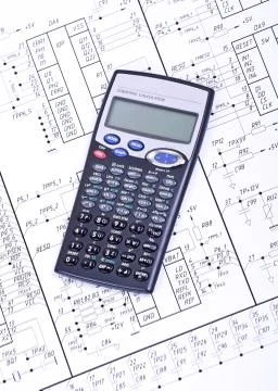 Calculator on the  drawing electrical circuit Stock Photos