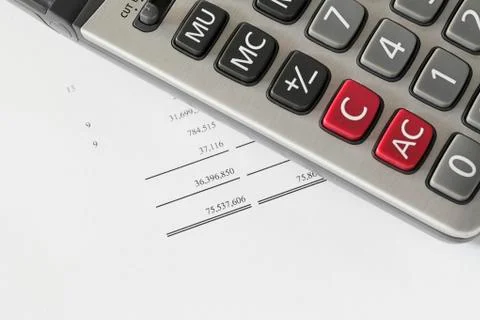 Calculator on finance statement Stock Photos