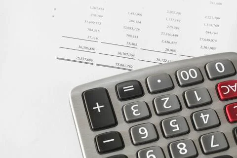 Calculator on finance statement Stock Photos