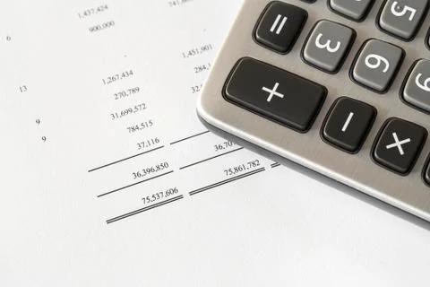 Calculator on finance statement Stock Photos