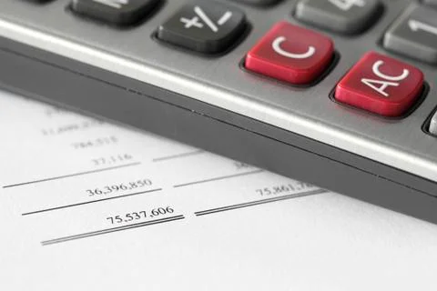 Calculator on finance statement Stock Photos