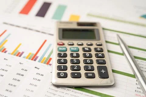 Calculator on graph paper. Finance development, Banking Account, Statistics.. Stock Photos