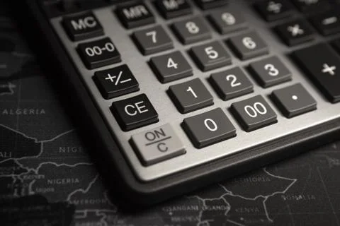 Calculator keys closeup on map background, business concept Stock Photos