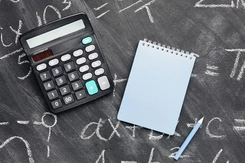 Calculator notebook chalkboard Stock Photos
