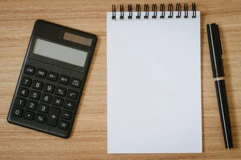 Calculator, notepad and pen 스톡 사진