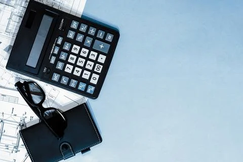 Calculator, notepad, black glasses on the working Stock Photos