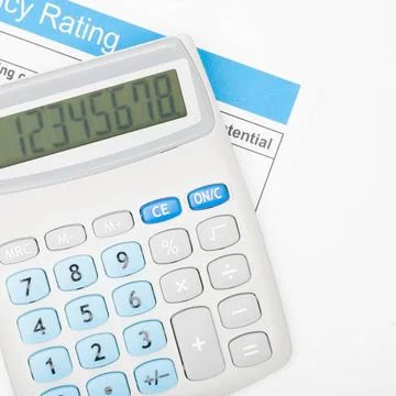  Calculator over energy efficiency chart Calculator over energy efficiency... Stock Photos