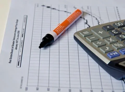 Calculator on paper  graph . Stock Photos