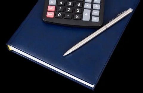 Calculator pen and notebook Stock Photos