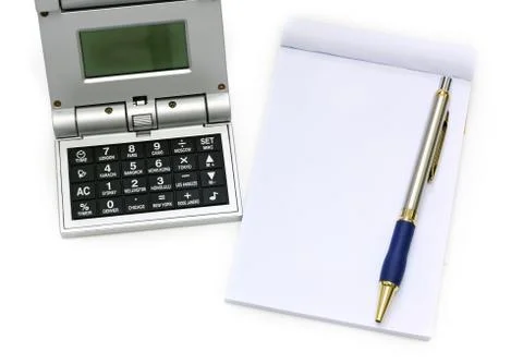 Calculator pen and notebook on white background Stock Photos