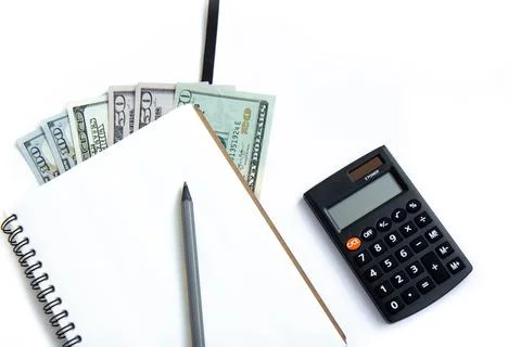Calculator, pen, open notepad and paper money isolated on white background Stock Photos