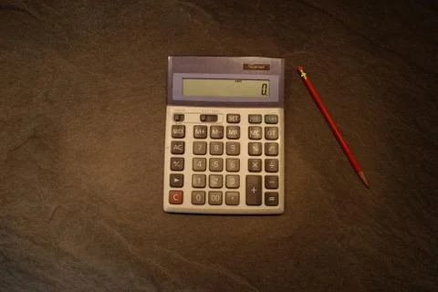 Calculator with pencil Stock Photos