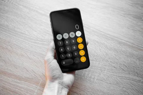 Calculator on the phone for calculation Stock Photos