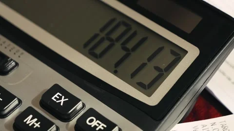 The calculator screen calculates numbers close up. The accountant calculates the Stock Footage 334837134
