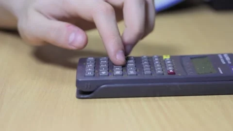 The calculator is on the table. Stock Footage