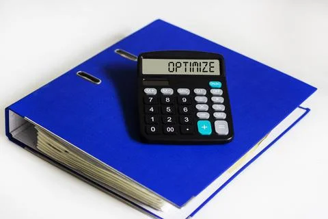 Calculator with text Optimization on the display and with a blue folder for d Stock Photos