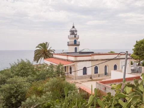 Calella Lighthouse is active lighthouse situated in coastal town of Calella in Stock Photos
