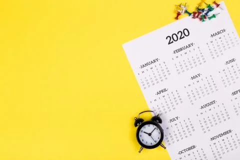 Calendar 2020  on solid yellow background with copy space, business meeting s Stock Photos