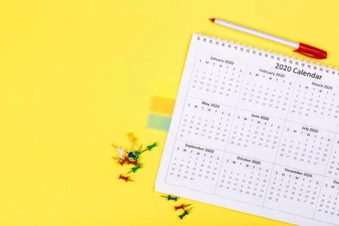 Calendar 2020  on solid yellow background with copy space, business meeting s Stock Photos