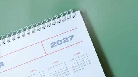 Calendar for 2027 on green background close-up top view. Video stock 341662270
