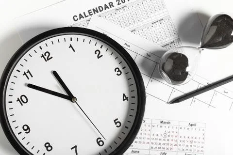 Calendar and Clock on White Background Stock Photos