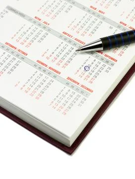 Calendar and pen Stock Photos