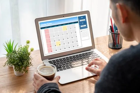 Calendar on computer software application for modish schedule planning Stock Photos
