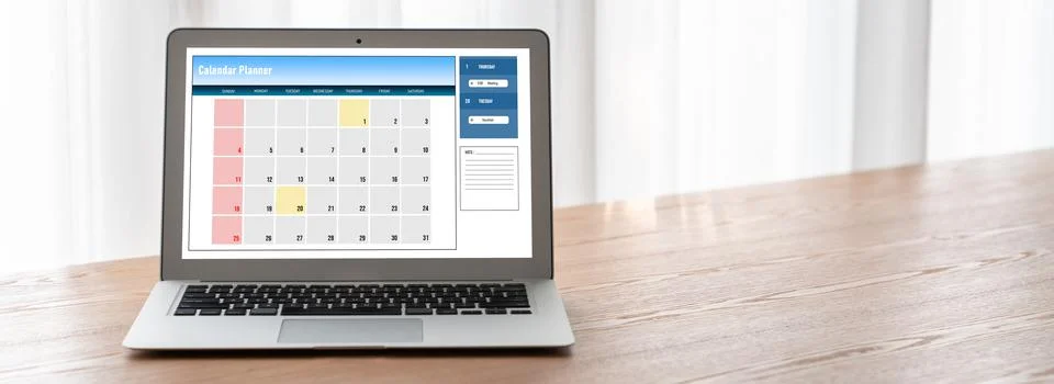 Calendar on computer software application for modish schedule planning Stock Photos