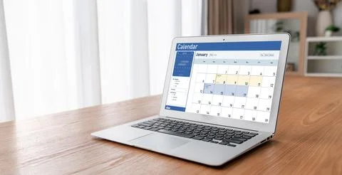 Calendar on computer software application for schedule planning snugly Stock Photos