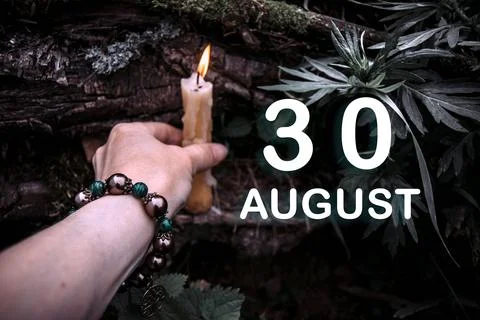 Calendar date on the background of an esoteric spiritual ritual. August 30 is Stock Photos