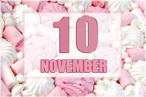 Calendar date on the background of white and pink marshmallows. November 10 i Stock Photos