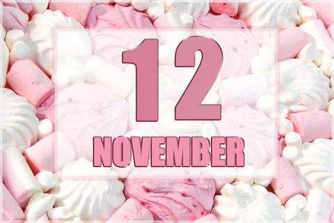 Calendar date on the background of white and pink marshmallows. November 12 i Stock Photos