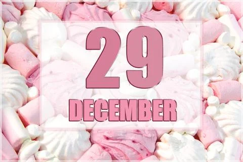Calendar date on the background of white and pink marshmallows. December 29 i Stock Photos