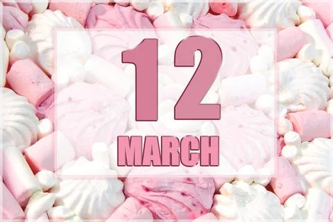 Calendar date on the background of white and pink marshmallows. March 12 is t Stock Photos
