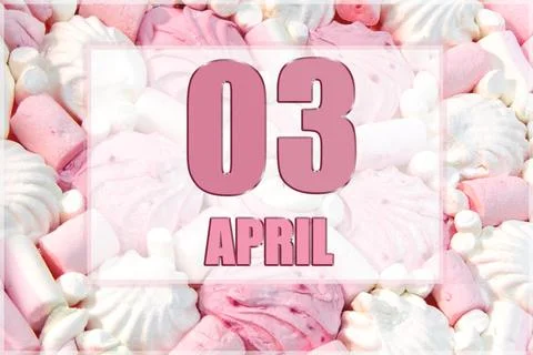 Calendar date on the background of white and pink marshmallows.  April 3 is t Stock Photos